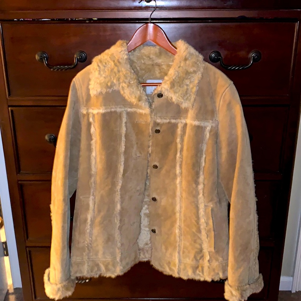Leather coat with faux fur lining; runs on the smaller side